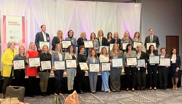 Women from across Minnesota representing companies recognized for gender diversity pose for a group photo at the TCB Talks: Women in Leadership event held April 19, 2022.